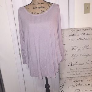 Flowy top with open sleeve detailing!